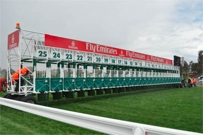 The start barrier is positioned for the 2010 Melbourne Cup. A single structure comprising 24 stalls, it is one of the largest start barriers in the world.