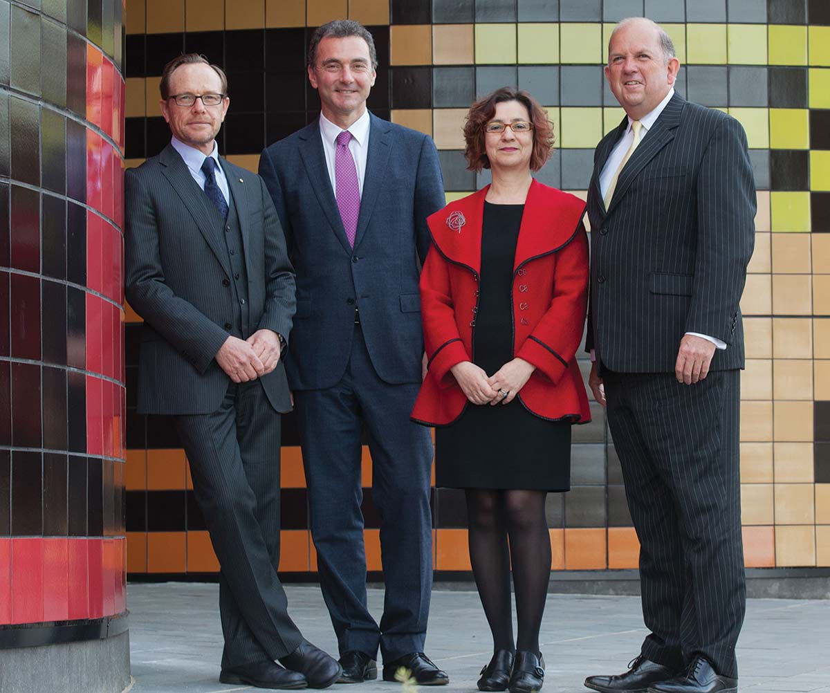 Four members of the Museum's Executive, standing in front of a tiled wall, from left: Director, Andrew Sayers; Assistant Director, Mathew Trinca; Assistant Director, Helen Kon; and Chief Operating Officer, Graham Smith.