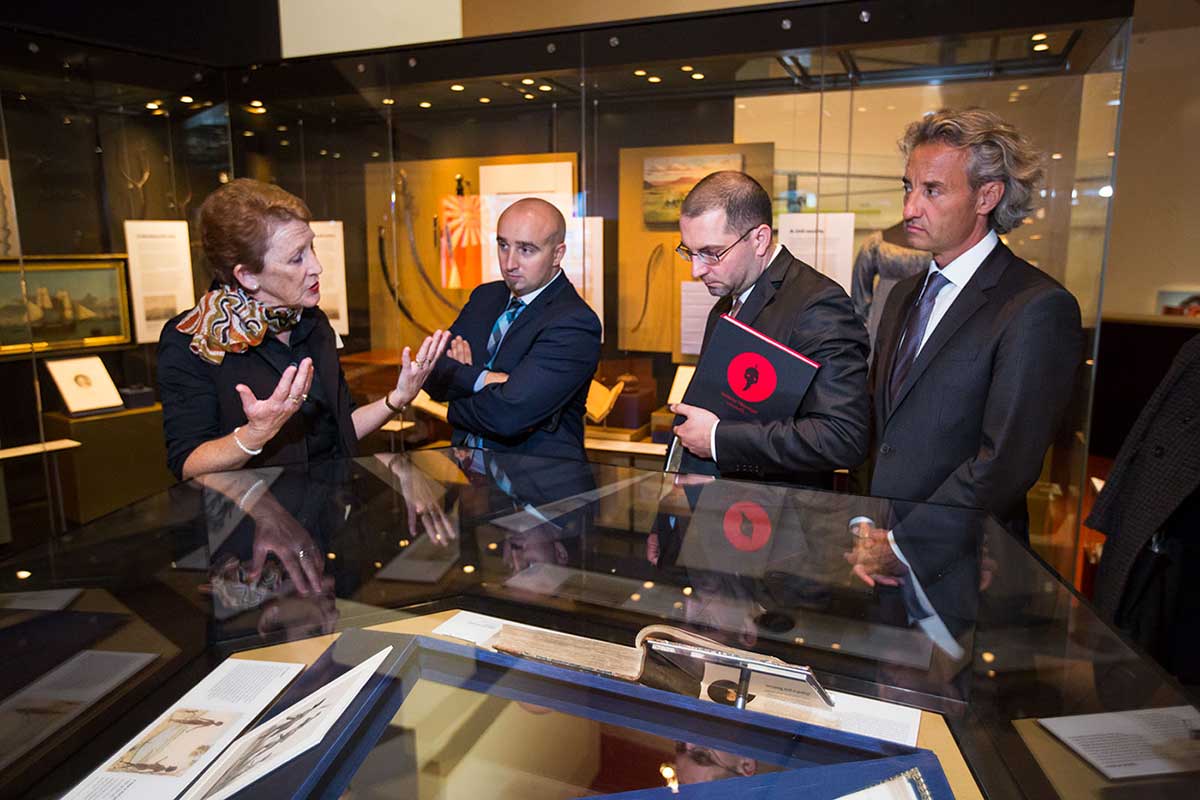 Museum host Linda Puckett taking French officials on a tour of the Museum